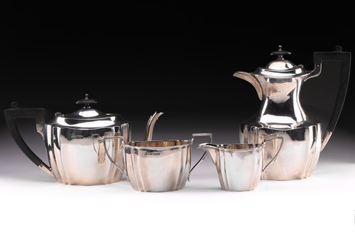 Lot 290 - A George V silver four-piece silver tea set,...