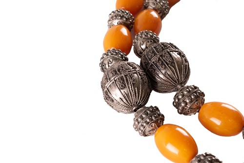 Lot 105 - A large Yemeni silver metal and amber necklace,...