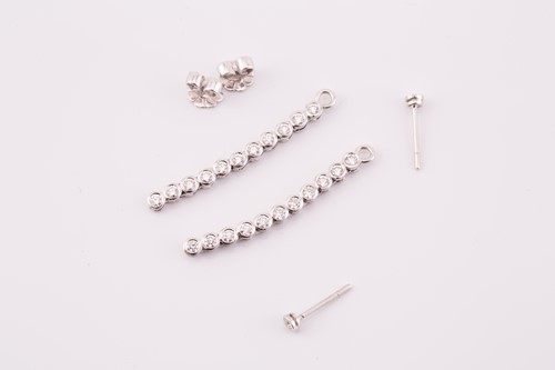 Lot 191 - A pair of diamond line drop earrings, each has...
