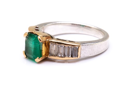Lot 135 - An emerald and diamond dress ring, centred...