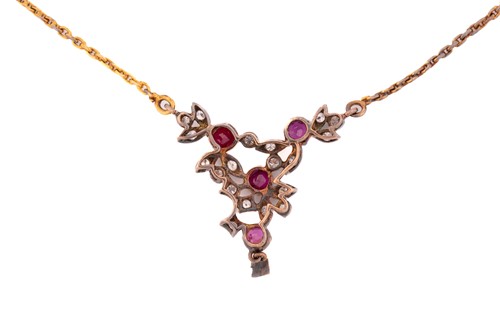 Lot 24 - A diamond and ruby necklace, with four round...