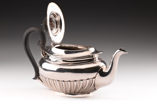 Lot 294 - An Edwardian three-piece silver tea set in...