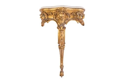 Lot A 19th-century carved wood and gilt gesso...