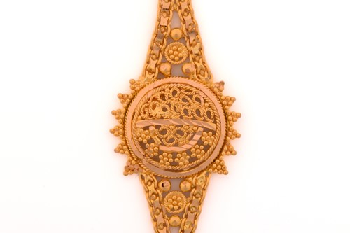 Lot 10 - A filigree bracelet; the central roundel, with...