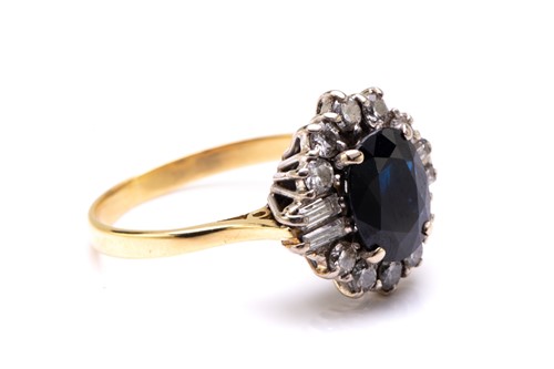Lot 33 - A sapphire and diamond cluster ring in 18ct...