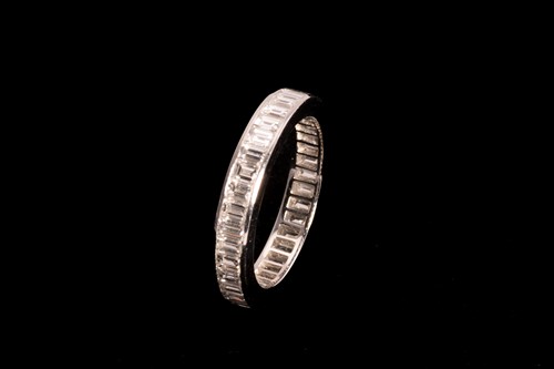 Lot 149 - A full hoop diamond eternity ring; the...