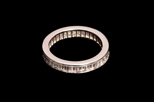Lot 149 - A full hoop diamond eternity ring; the...