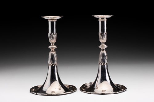 Lot 416 - A pair of continental white metal candlesticks...