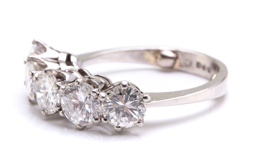 Lot 90 - A five-stone diamond ring in platinum,...