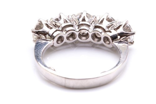 Lot 90 - A five-stone diamond ring in platinum,...