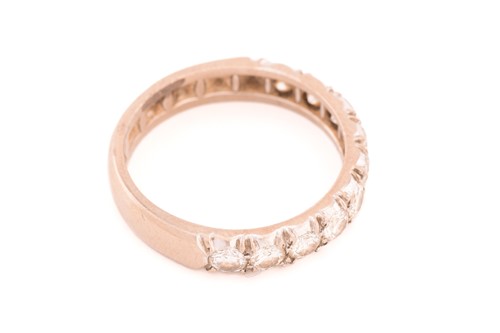 Lot 50 - A diamond half eternity ring, comprises ten...