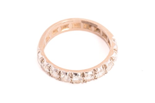 Lot 50 - A diamond half eternity ring, comprises ten...