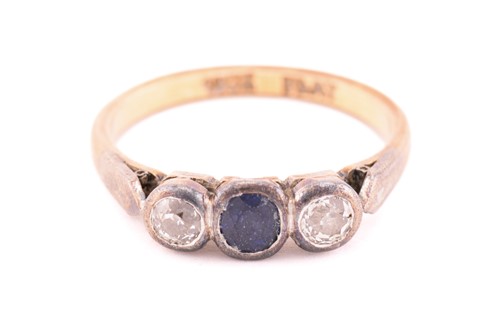 Lot 16 - A three-stone ring with sapphire and diamonds,...