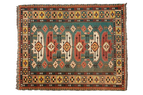 Lot A 20th-century cupric green ground Kazak rug...