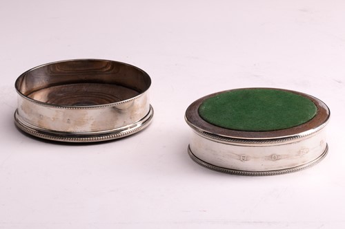 Lot 309 - A pair of modern silver bottle coasters with...