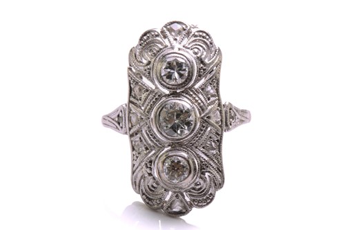 Lot 7 - An Art Deco diamond panel ring, composed of...