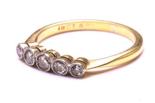 Lot 61 - A five-stone diamond half hoop ring, comprises...