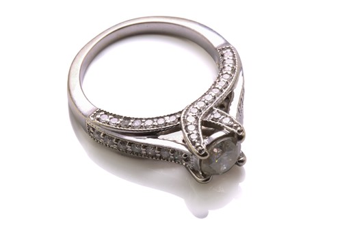 Lot 137 - A diamond trellis engagement ring and a fitted...