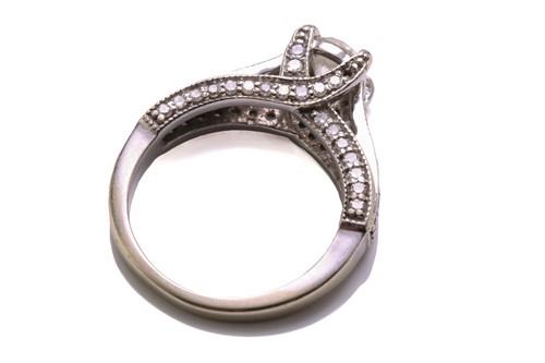Lot 137 - A diamond trellis engagement ring and a fitted...