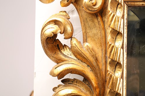 Lot A carved and gilt rococo style wall mirror,...