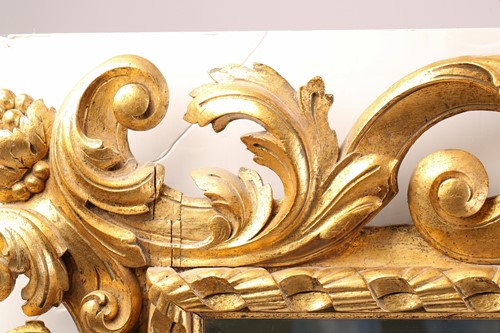 Lot A carved and gilt rococo style wall mirror,...