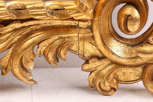 Lot 264 - A carved and gilt rococo style wall mirror,...