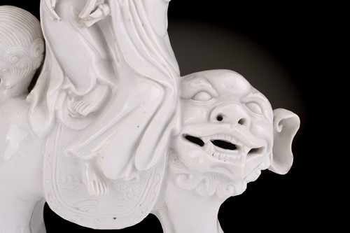 Lot 207 - A Chinese Dehua blanc de chine figure of...