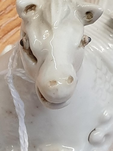 Lot 193 - A Chinese Dehua blanc de chine white horse of...