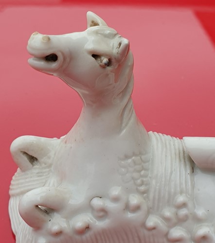 Lot 193 - A Chinese Dehua blanc de chine white horse of...