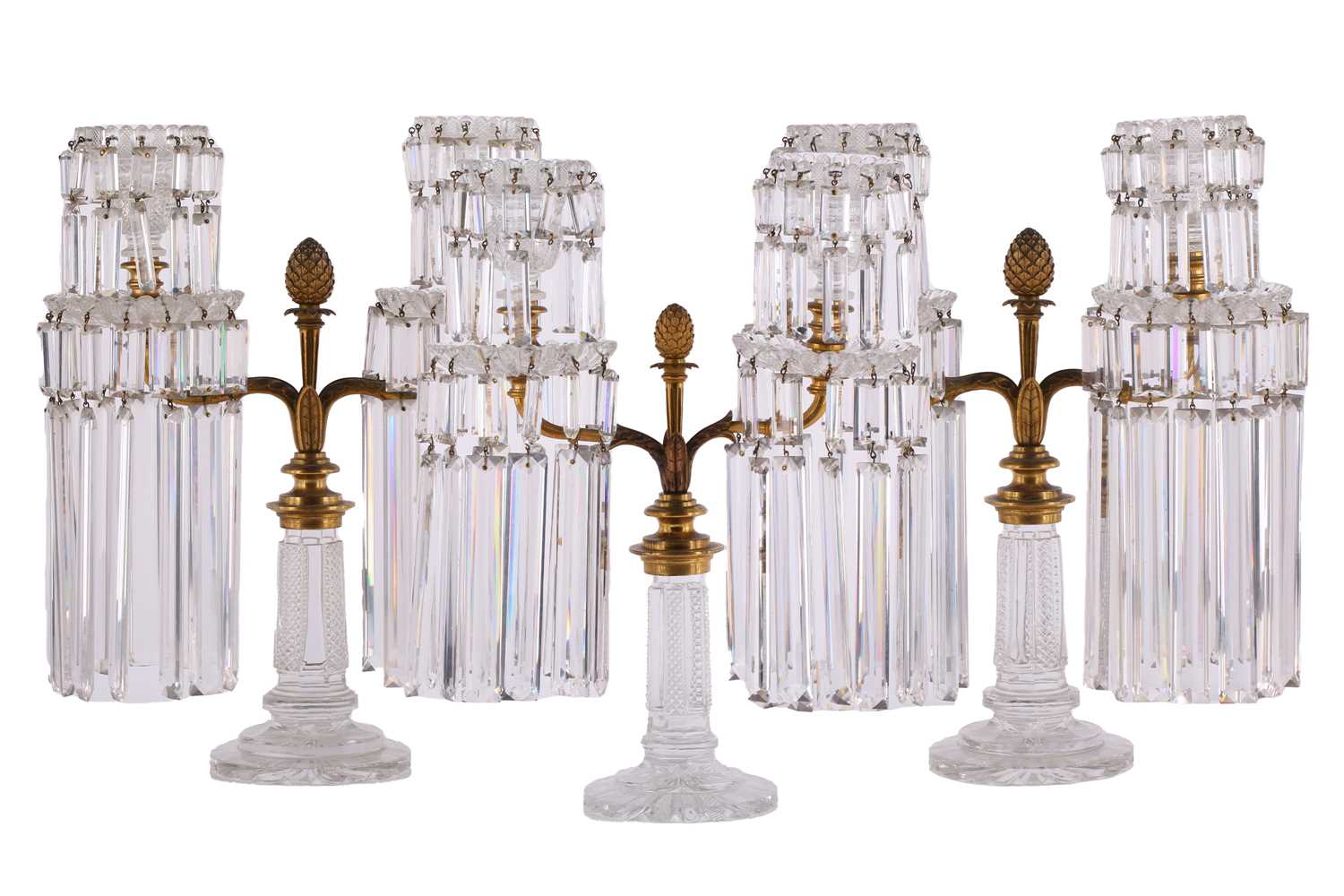 Lot 344 - A Regency garniture of three cut glass lustre...