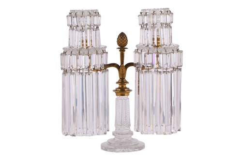 Lot 344 - A Regency garniture of three cut glass lustre...