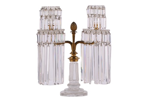 Lot 344 - A Regency garniture of three cut glass lustre...