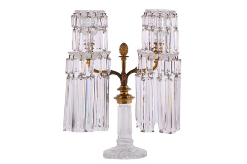 Lot 344 - A Regency garniture of three cut glass lustre...