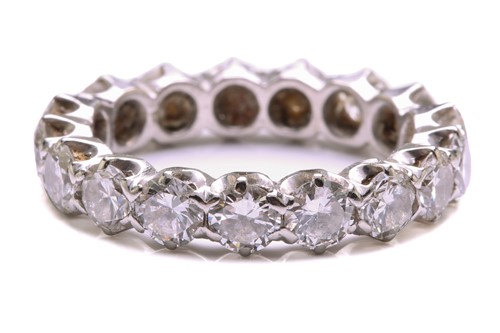 Lot 133 - A diamond eternity ring, featuring seventeen...