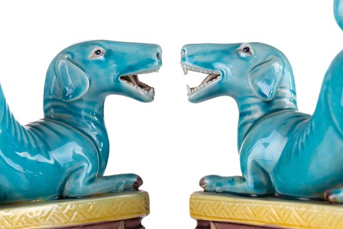 Lot 184 - A pair of Chinese torquoise glazed dogs, Qing...