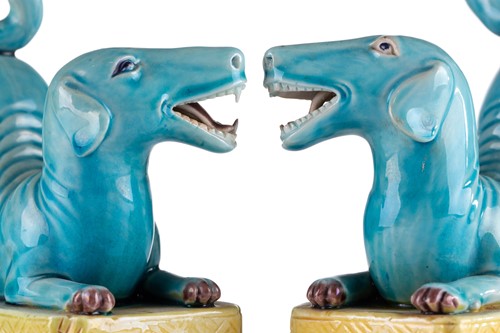 Lot 184 - A pair of Chinese torquoise glazed dogs, Qing...