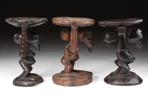 Lot 44 - Three Songye caryatid stools, Democratic...