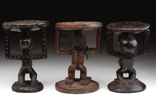 Lot 44 - Three Songye caryatid stools, Democratic...
