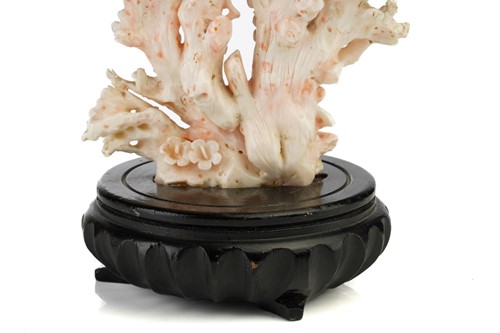 Lot 94 - A Chinese mottled pink/white coral carving in...
