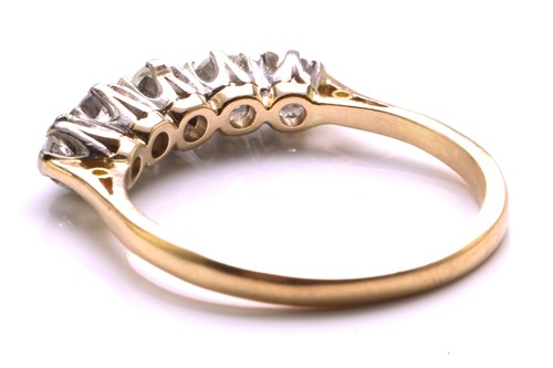 Lot 81 - A five-stone diamond half hoop ring, comprises...