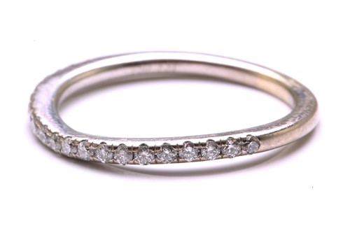 Lot 23 - A diamond-set half eternity ring, consisting...