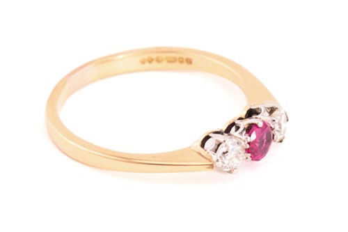 Lot 119 - A ruby and diamond three-stone ring in 18ct...