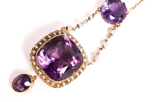 Lot 68 - An amethyst and seed pearl lavalier necklace,...