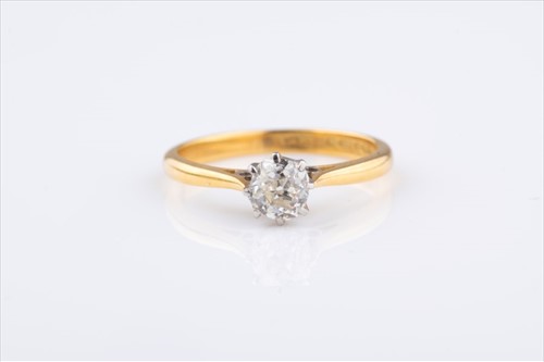 Lot 514 - An 18 carat gold diamond solitaire ring the...