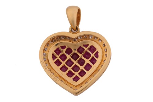 Lot 123 - A ruby and diamond heart pendant, featuring...