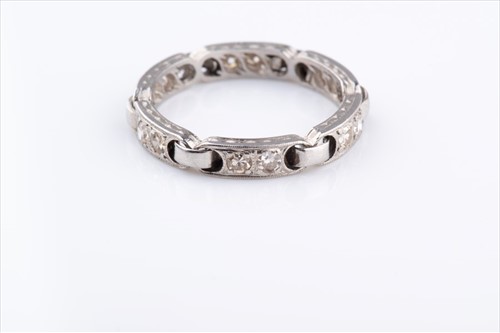 Lot 510 - An unusual diamond eternity ring set with...