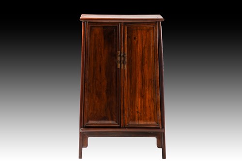 Lot 237 - A Chinese Huanghuali tapering two-door cabinet...
