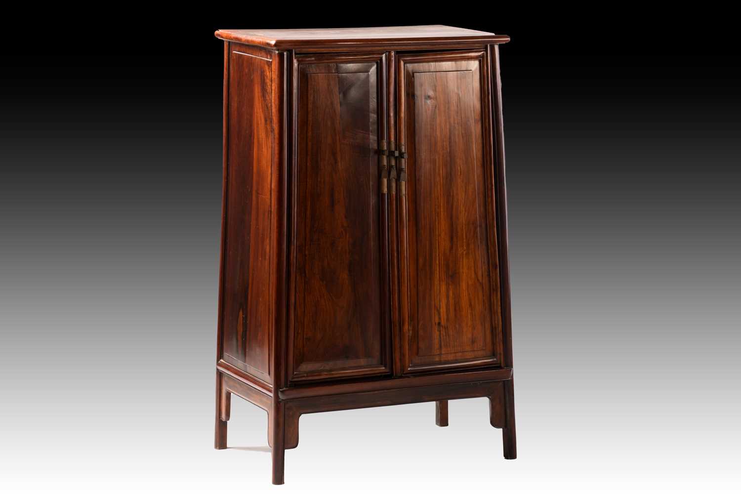 Lot 237 - A Chinese Huanghuali tapering two-door cabinet...