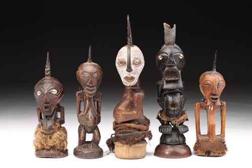 Lot 6 - A group of five songye power figures, Nikisi,...
