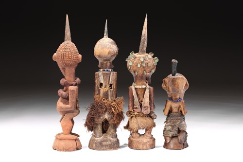Lot 149 - A group of four Songye power figures, Nkisi,...